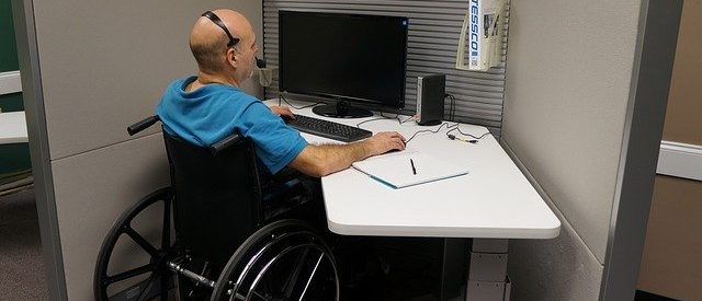 disabled person in front of a computer