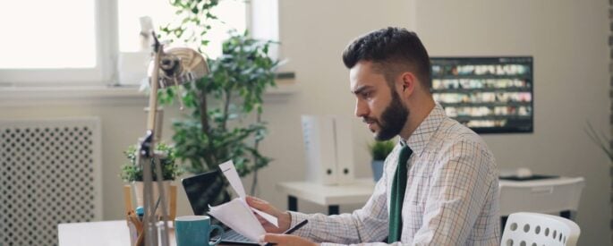 Photo by Vitaly Gariev: https://www.pexels.com/photo/man-sitting-at-office-and-reading-papers-22046210/
